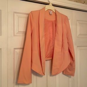 Candie’s women’s jacket, size M. Lighter than salmon, but not really peach.